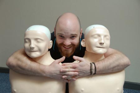 Image of Ben with resuscitation dolls